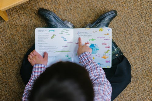 photo of a boy reading