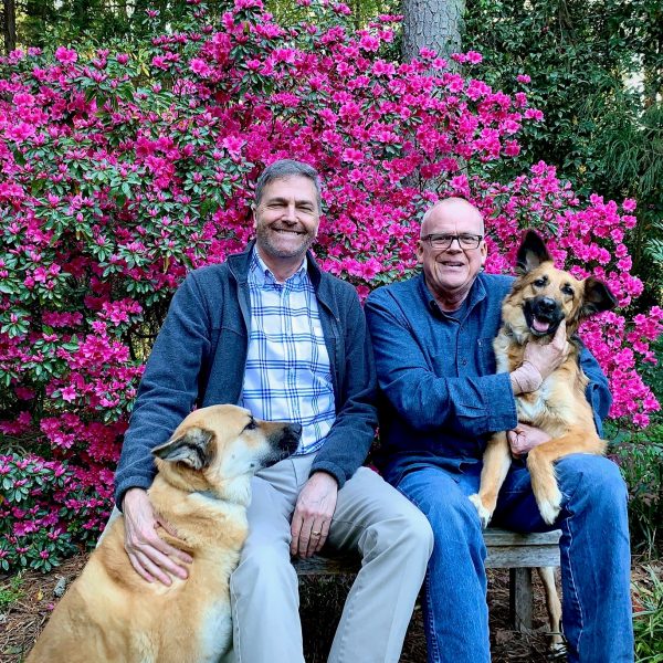 Brian McCann and Tom Costales with their dogs Muuki and Harper Lee. Courtesy of Brian McCann