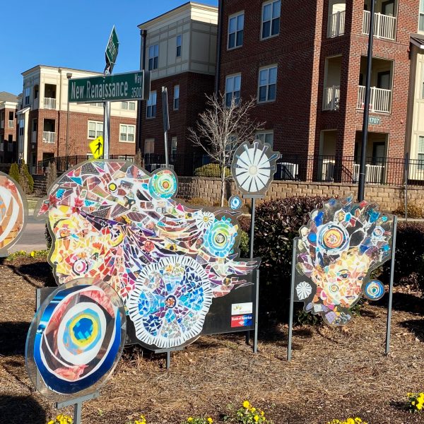 A collage titled "Welcoming Dreams" greets people at the entrance to the Renaissance West community.