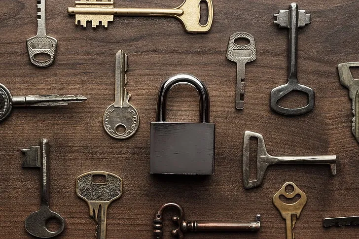 image of a lock and keys on a piece of wood